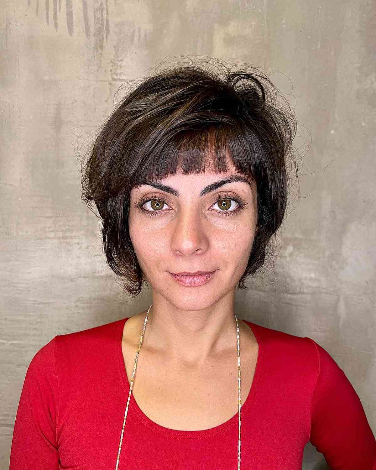 Short Layered Bob with Blunt Bangs for Ladies in their Forties