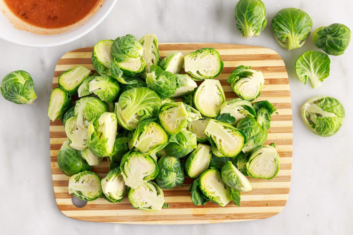 Brussels sprouts cut on cutting board