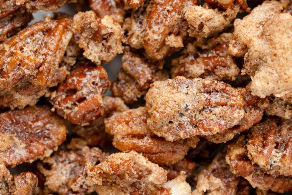 Air fryer candied pecans on a baking sheet