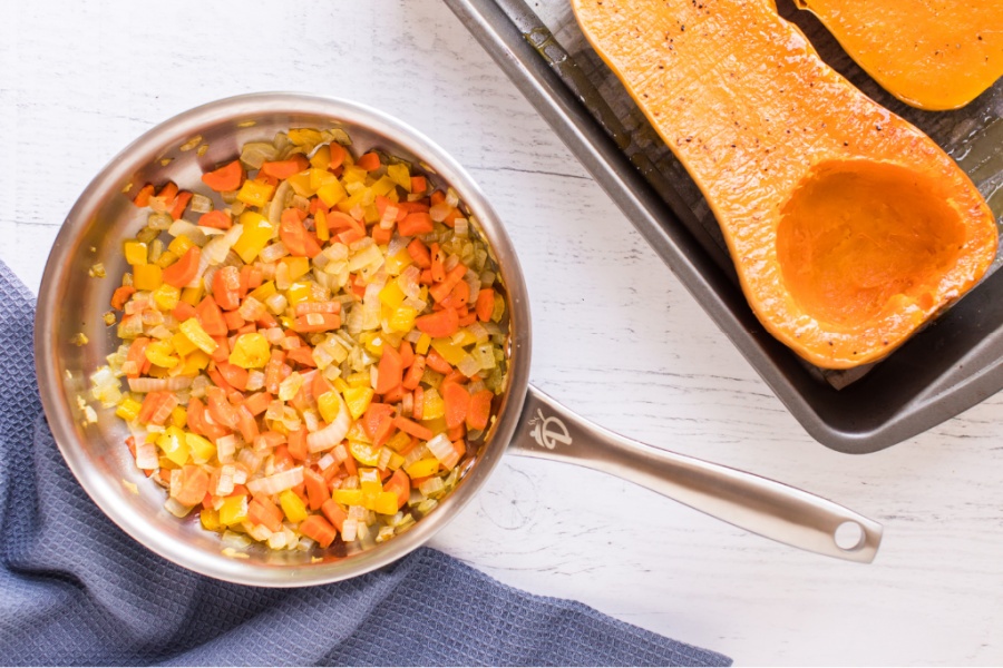 chopped vegetables in a saucepan with pumpkin cooked in a saucepan