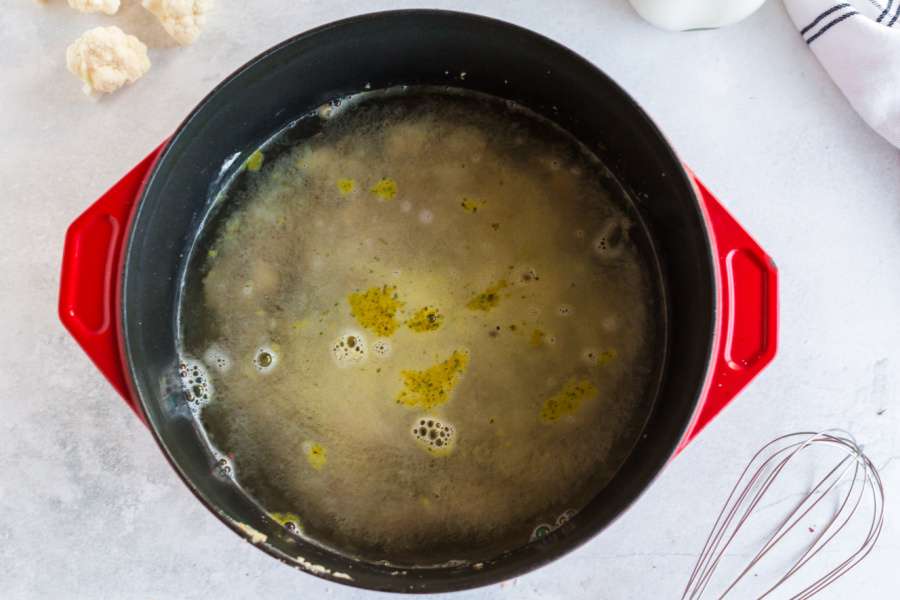 adding water to the pot