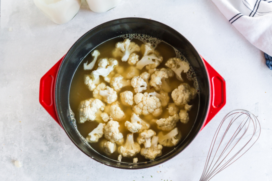 cauliflower added to soup pot