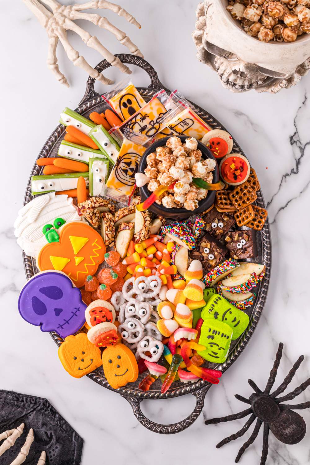 This fun Halloween snack board for kids is so fun and easy to create that kids could literally put it together for their friends. via @familyfresh