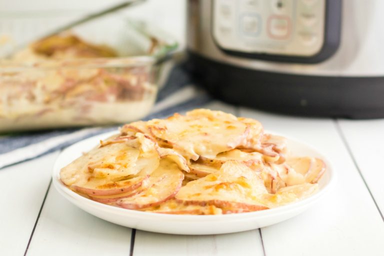Instant-Pot-Scalloped-Potatoes-served-on-a-white-plate