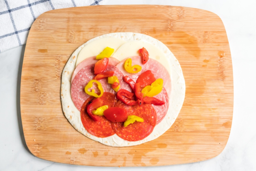 sausages, cheese, peppers and mayonnaise in a tortilla