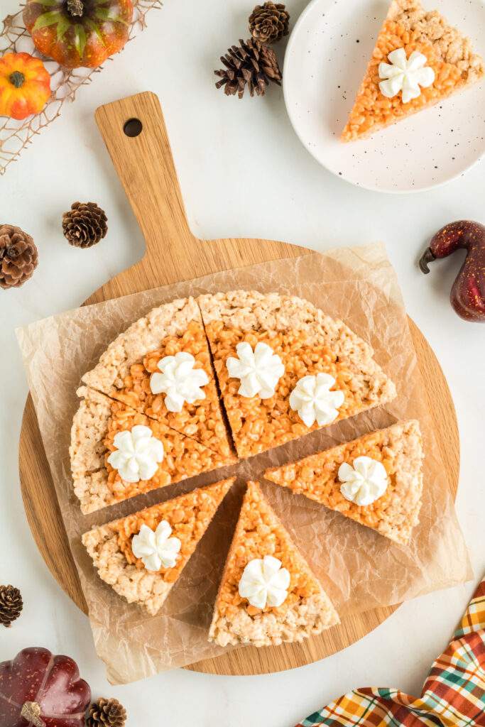 Pumpkin Pie Rice Krispies Treats on a cutting board
