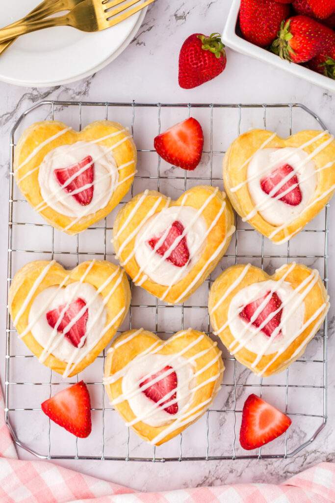 Strawberry Cream Cheese Heart Cakes on a drying rack