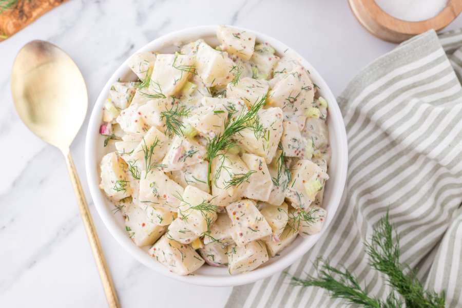 potato salad with dill in a bowl
