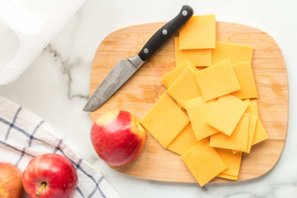 sliced ​​cheese on cutting board