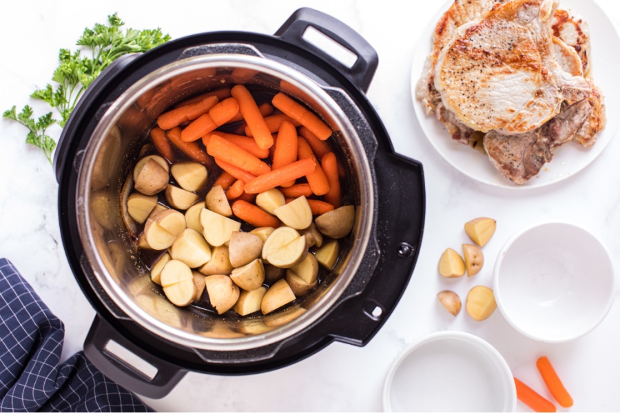 top down image of potatoes and carrots in the instant pot