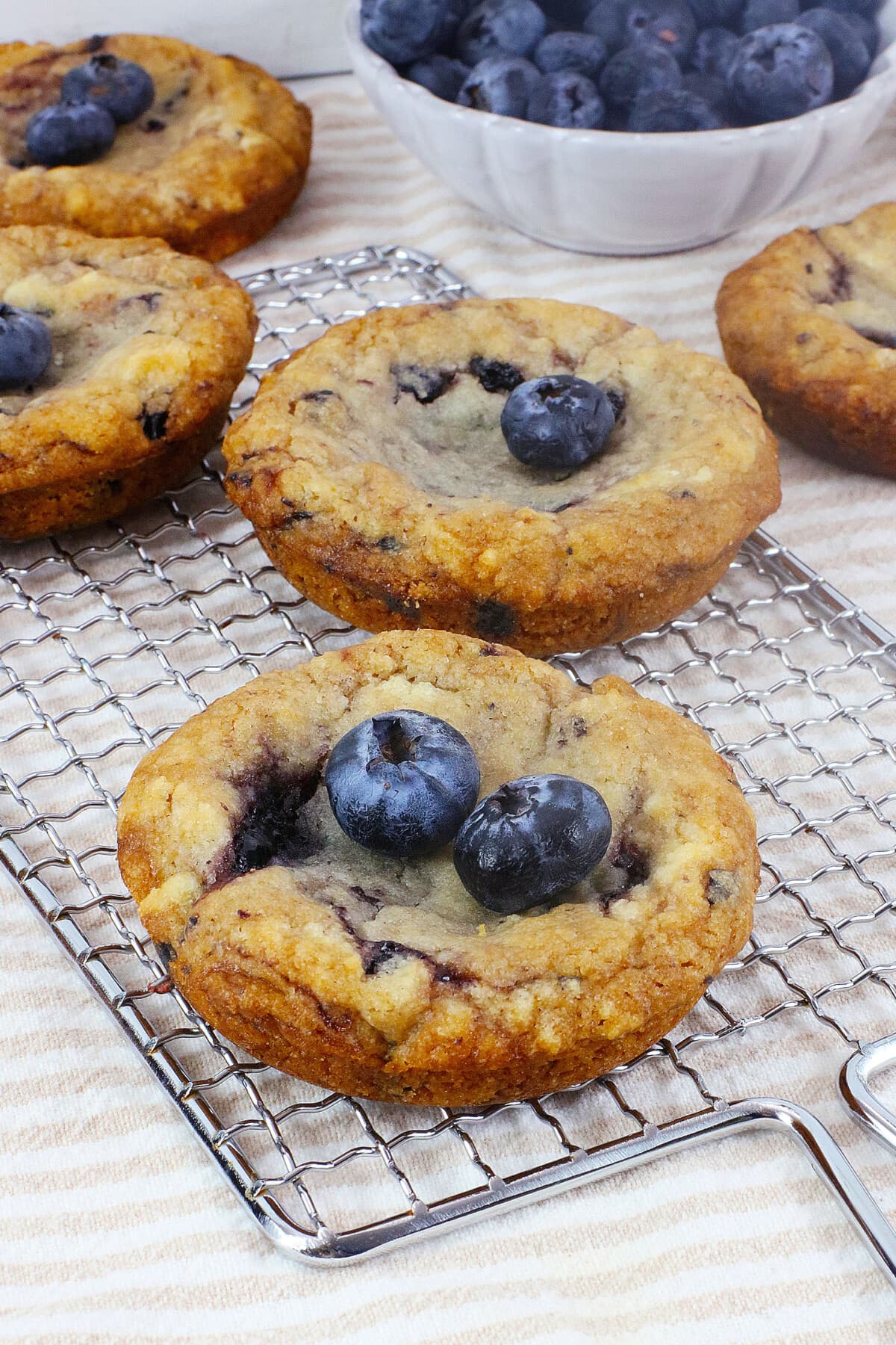 Blueberry Muffin Cookies in a single layer on a wire rack.