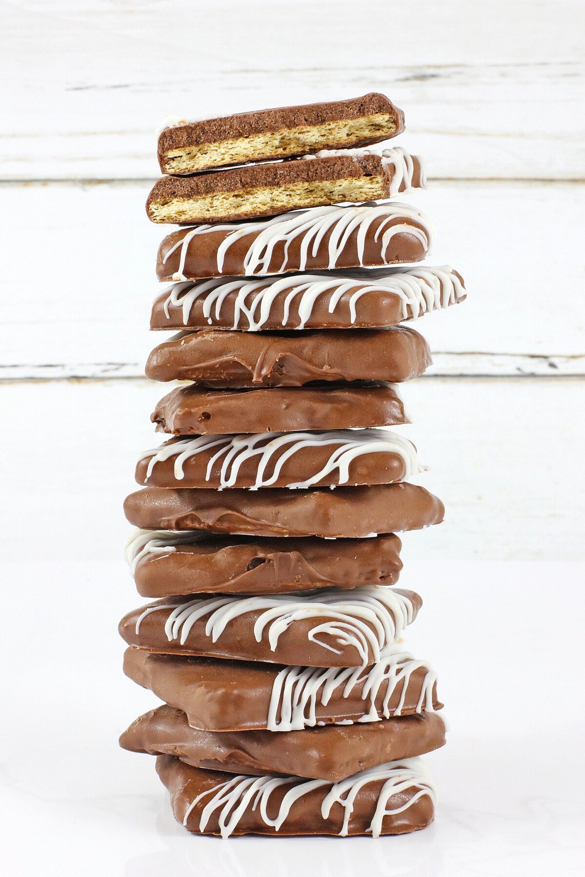 A large stack of chocolate covered graham crackers.