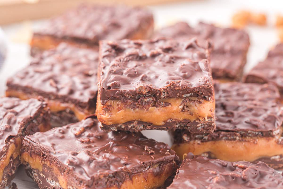 100 Homemade Grand Bars stacked on a plate