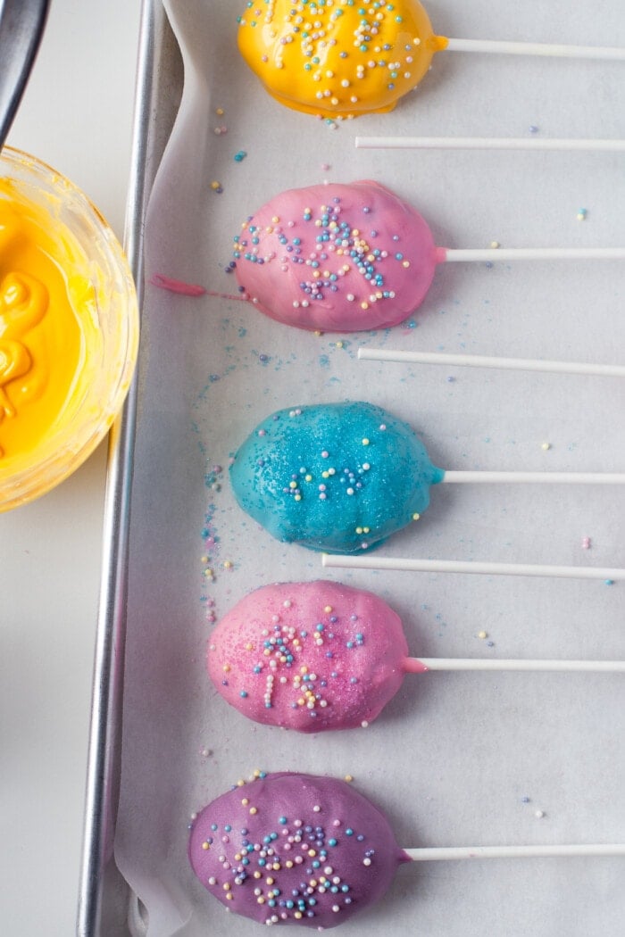 easter egg cake pops in a pan to harden