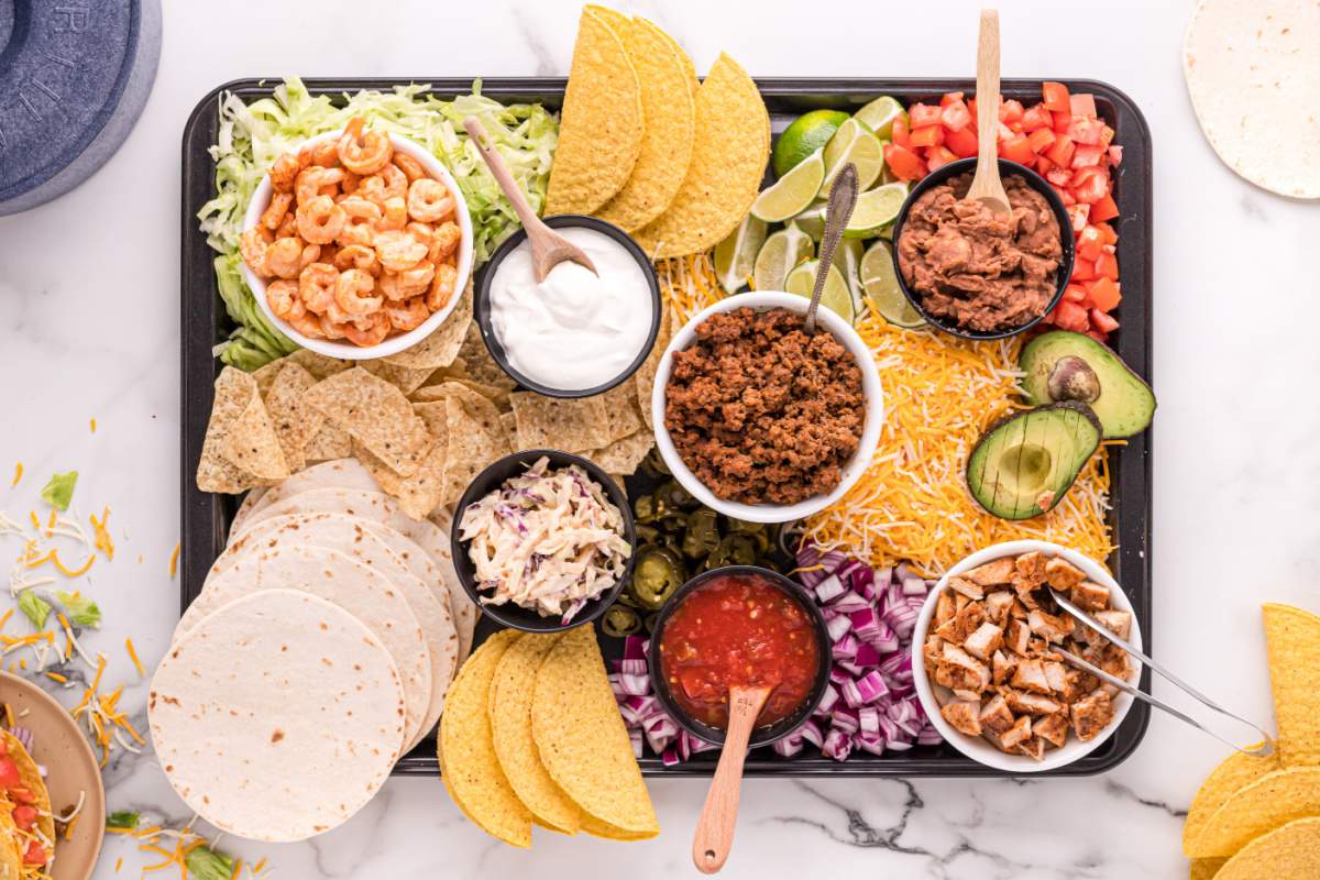 Taco board with serving spoons