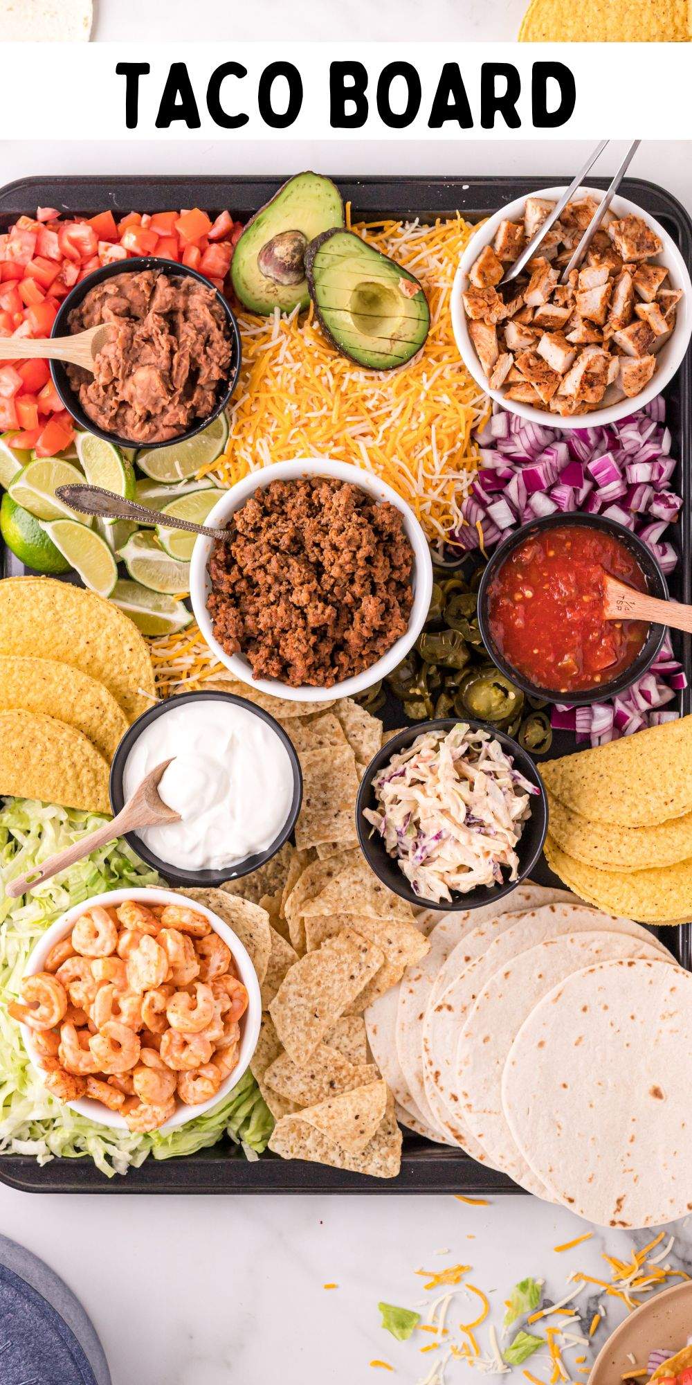 It's taco night, and this is the way to build your own taco board that everyone can gather around. A perfect themed charcuterie dinner board. via @familyfresh