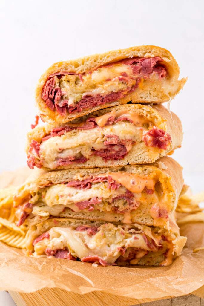 Junk Reuben Bread Slices Stacked On A Cutting Board