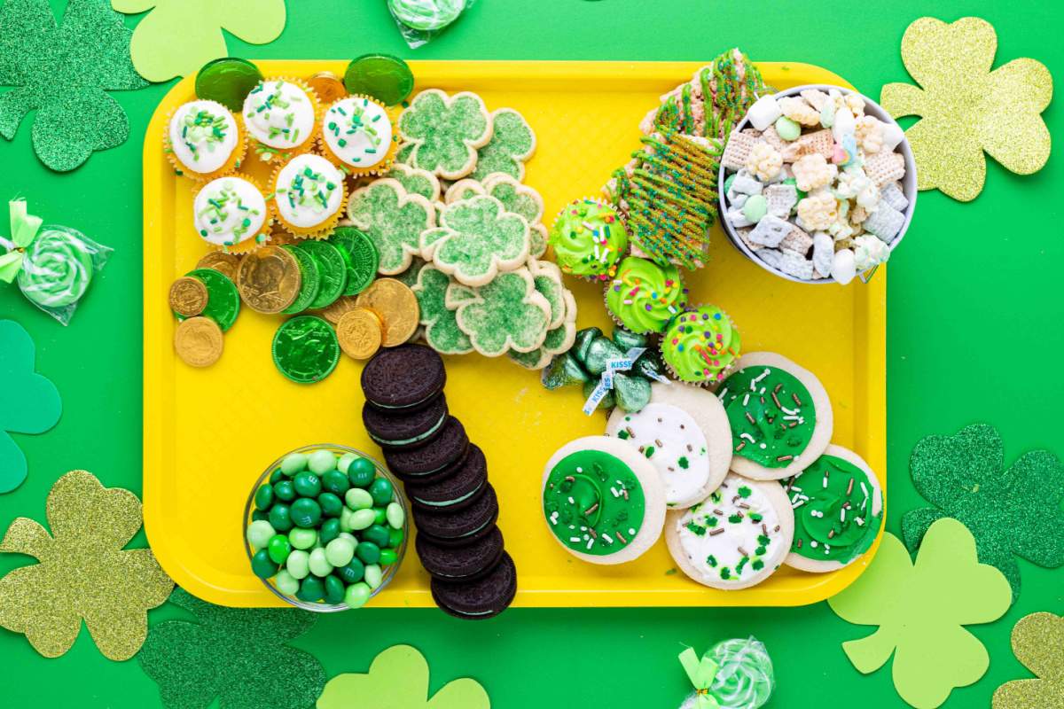 green colored cookies and candies added to the tray
