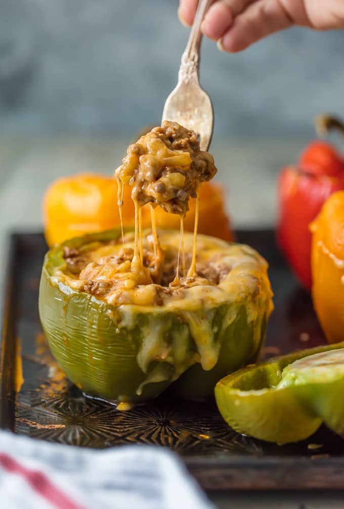Fork pulling Mexican stuffed peppers cheese steak