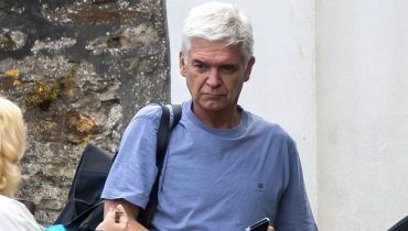 Glum Phillip Schofield clutches vape as he emerges from Cornish bolthole after weeks in hiding