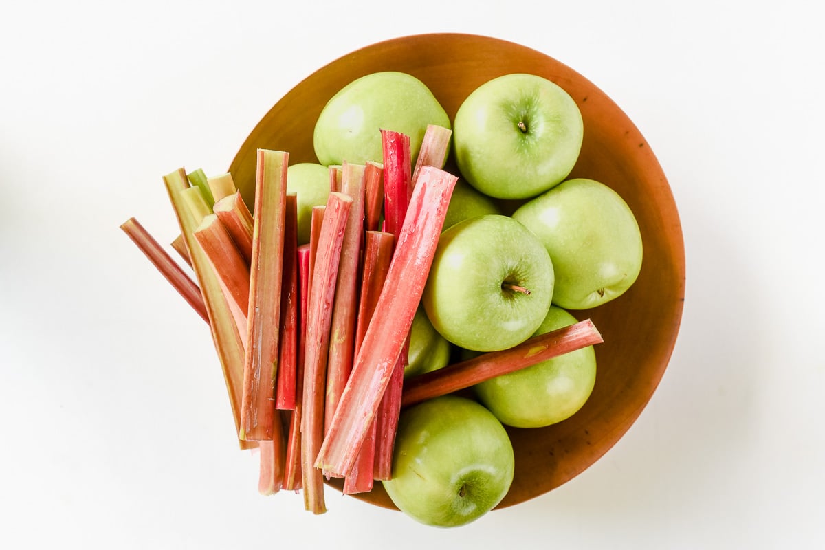 apples and rhubarb in a bowl.