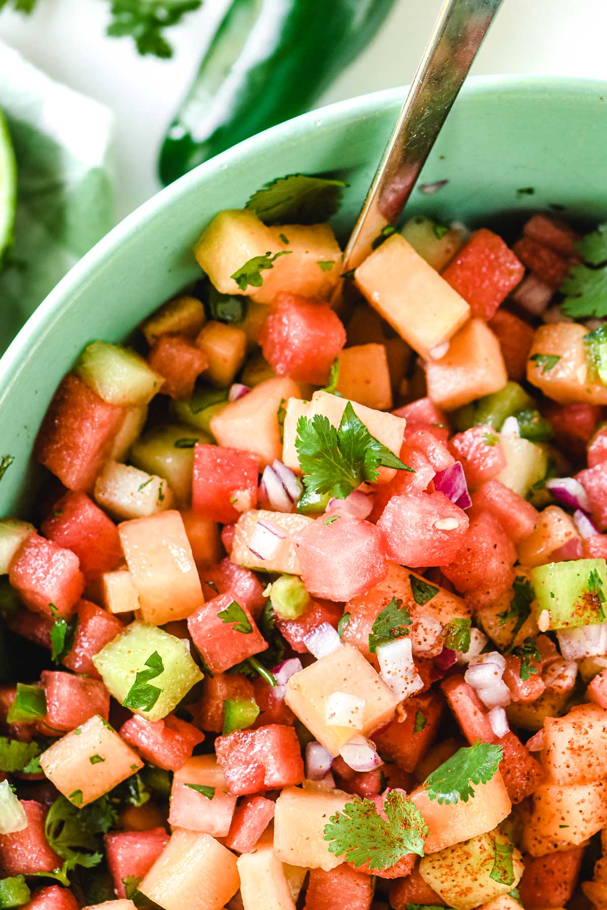 detail of melon salad with chili, lime and cilantro.