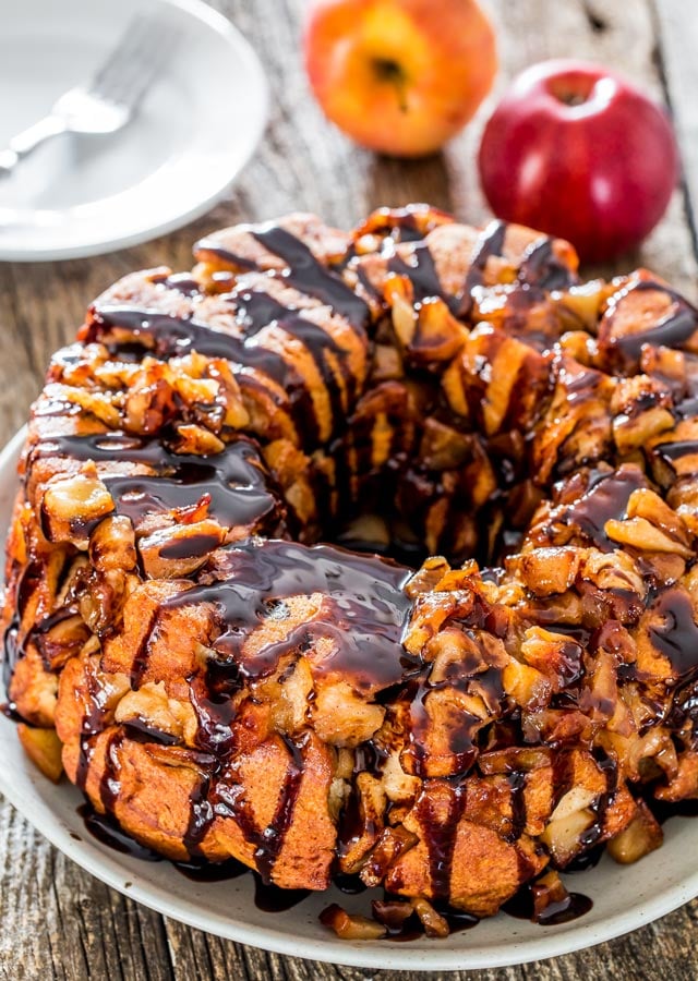 Monkey bread with apple pie on a plate drizzled with chocolate sauce
