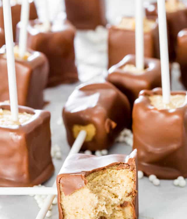 chocolate peanut butter cheesecake popsicles with a bite taken from one