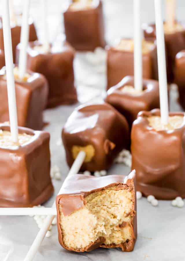 Chocolate Peanut Butter Cheesecake Pops - Creamy chocolate peanut butter cheesecake pops perfect for parties and fun to make with your kids.