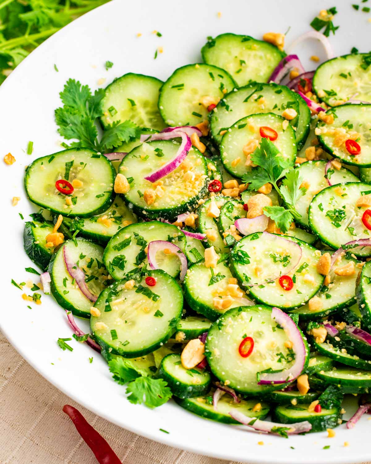 Thai Cucumber Salad garnished with Peanuts and Thai Chilis
