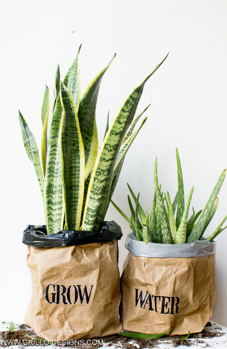 A pair of planter bags made from wrapping paper/kraft/grillo designs www.grillo-designs.com