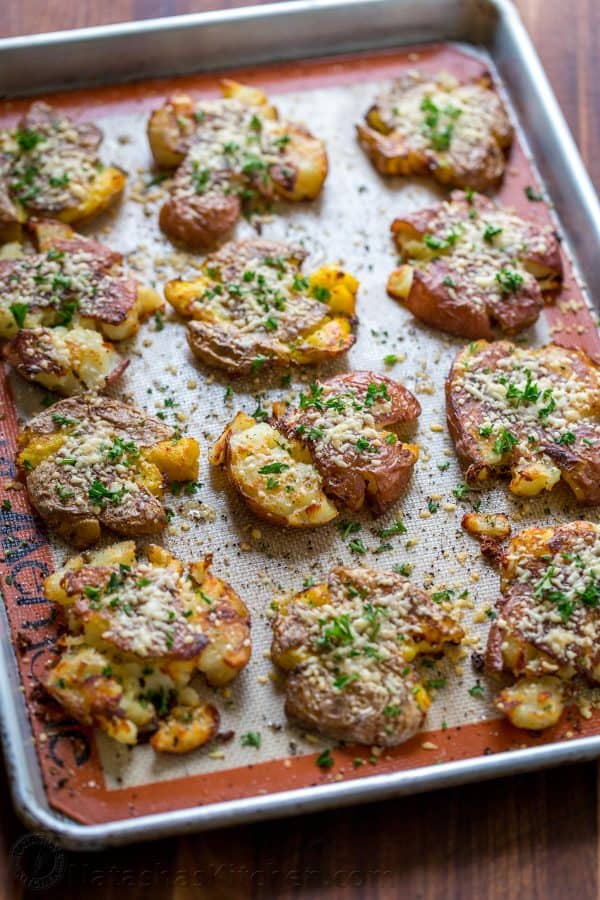 These cheesy smashed potatoes are crisp on the outside with a creamy center and irresistible cheesy crust. 