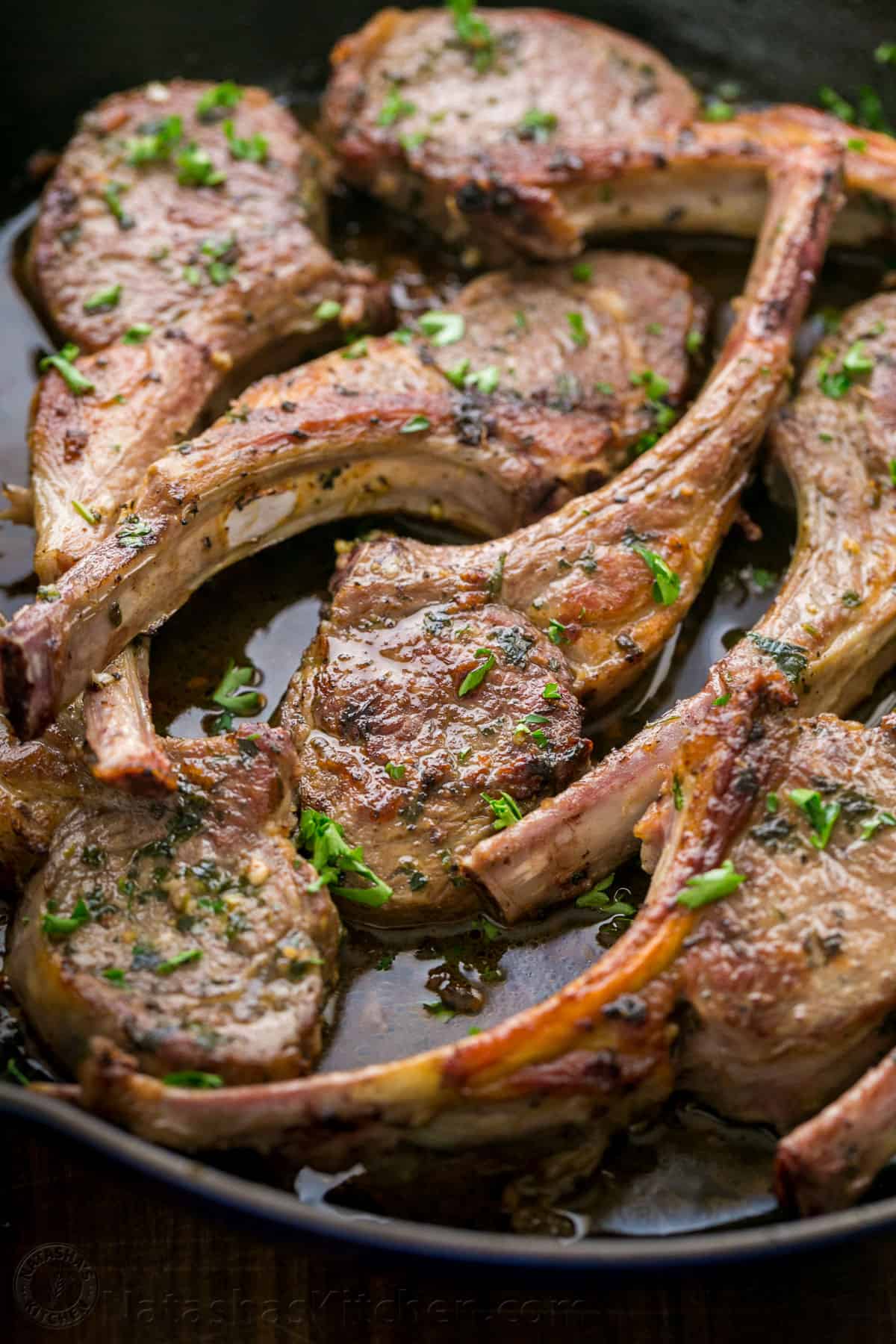 Pan Seared Lamb Chops cooked in a skillet 
