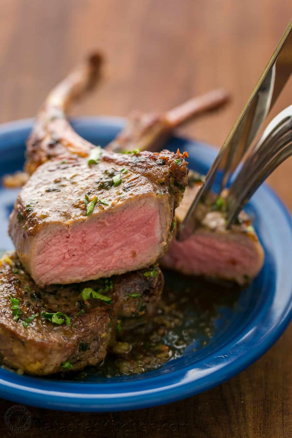 Sliced piece of lamb chop to show juicy center