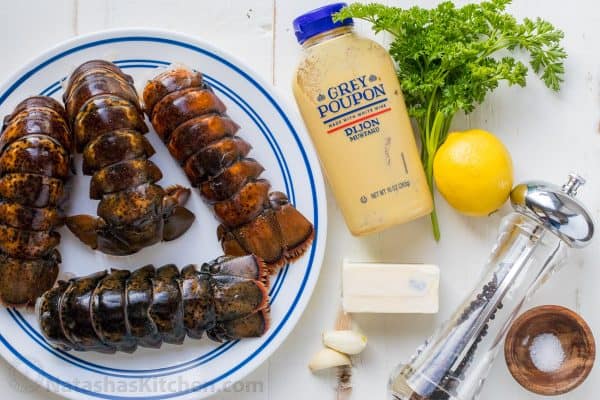 Ingredients for broiled lobster tails with lobster, butter, lemon, garlic, parsley