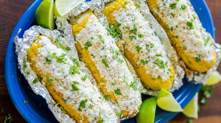 chili powder Cilantro cotija cheese crema sauce Elote foil grilled corn Grilling grilling safety Instructions Mexican festivals Mexican Street Corn Recipe Sauce serving side dish 