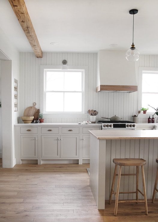 white kitchen with shiplap backsplash