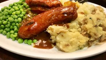 Delicious Sausage and Potato Dinner: Bangers and Mash with Flavorful Onion Gravy for the Whole Family