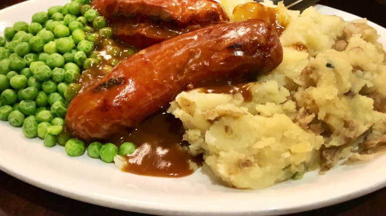 Delicious Sausage and Potato Dinner: Bangers and Mash with Flavorful Onion Gravy for the Whole Family Bangers Bangers and Mash British Cuisine Classic British Fare Comfort Food Comforting Meal cooking instructions delicious Dinner Easy Dinner Recipe family Family-Friendly Recipe Flavorful Flavorful Sausages Gravy Hearty Meal Homemade Gravy Mash mashed potatoes Onion Onion Gravy Recipe Pork Sausages Potato Potato Mash Rustic Dinner Sausage Sausage and Mash Savory Sausages simple ingredients Traditional British Dish Wholesome Recipe