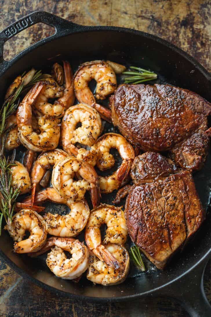 Surf and turf cooked in skillet with rosemary garlic butter