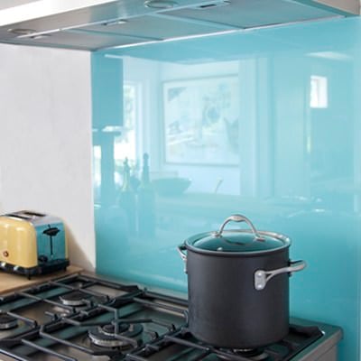 blue glass backsplash behind stovetop