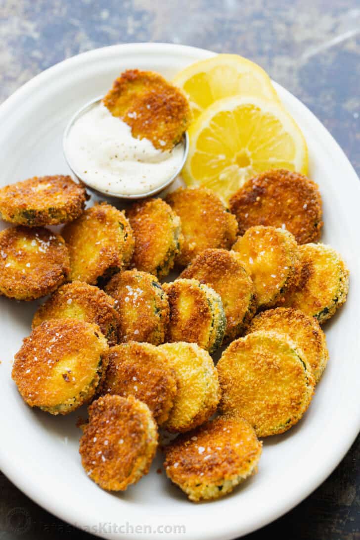 Fried Zucchini Crisps served with dipping sauce.