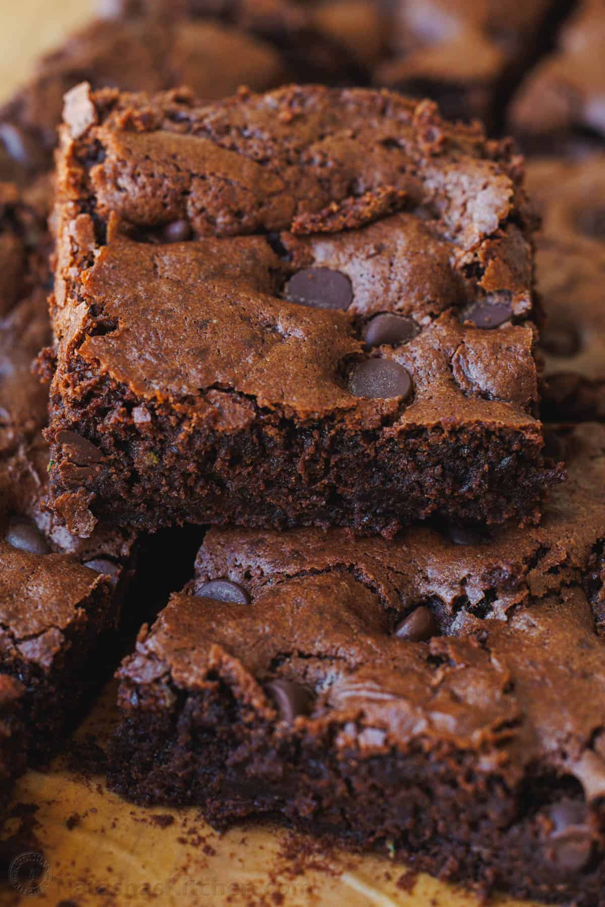Zucchini brownies with chocolate chips baked inside, cut into squares