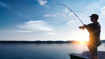 A man inquires about the secret behind a young boy’s exceptional fishing skills