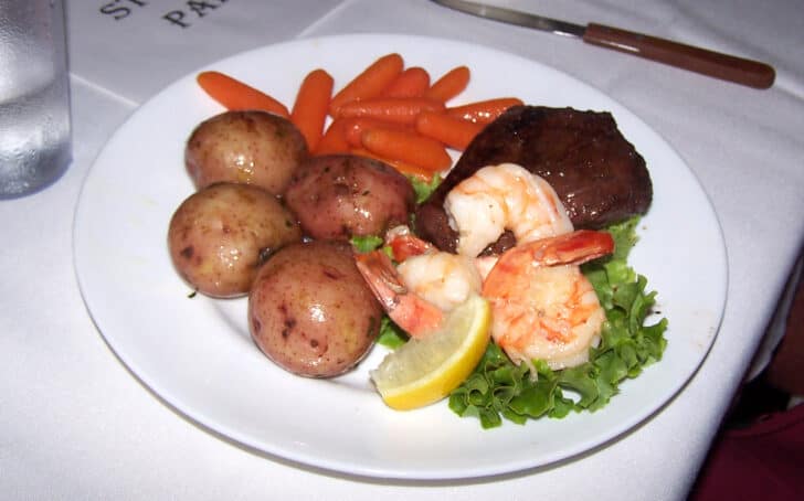 Restaurant plate of steak, shrimp and potatoes