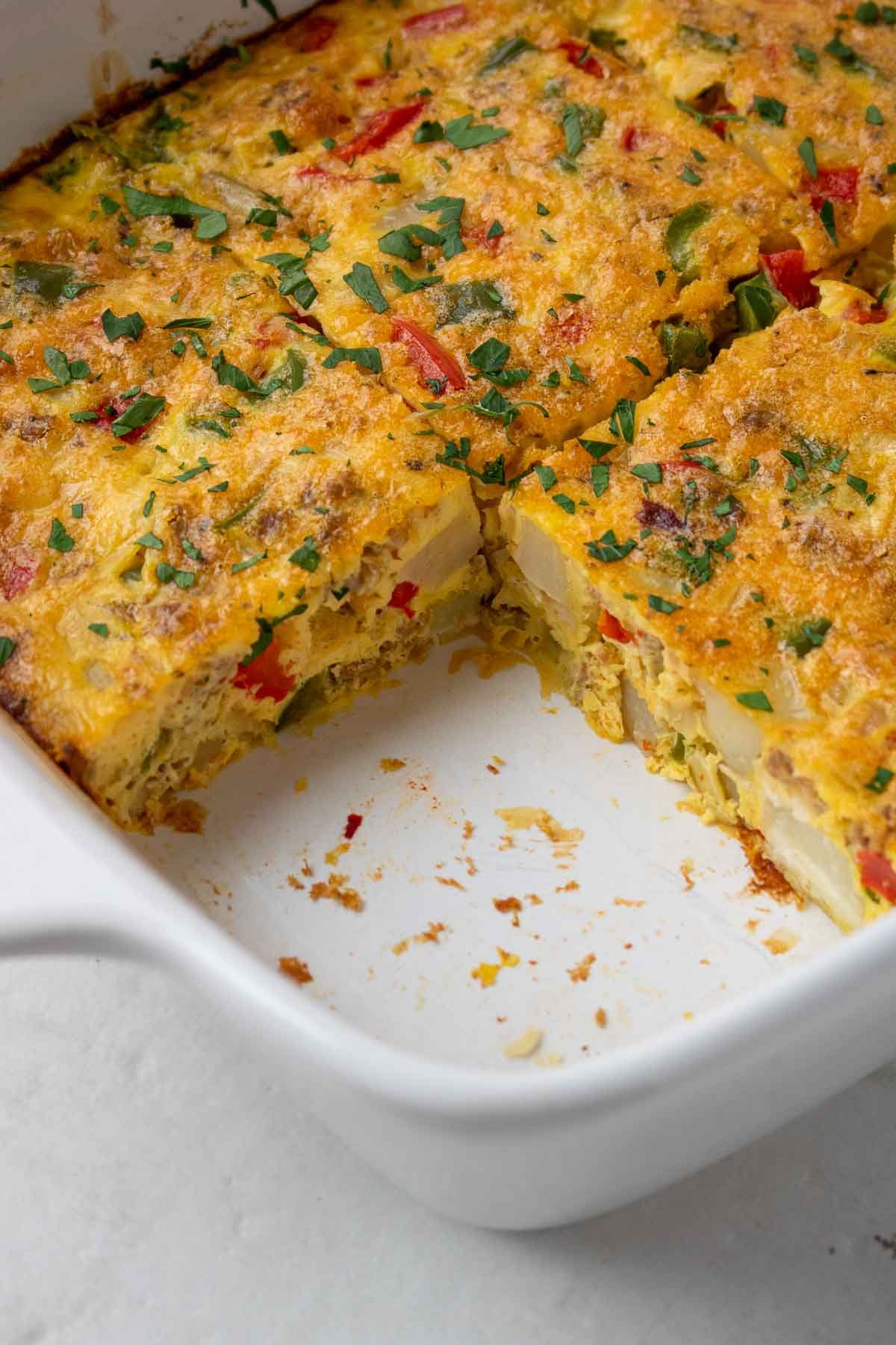 Cooked breakfast casserole with a slice missing