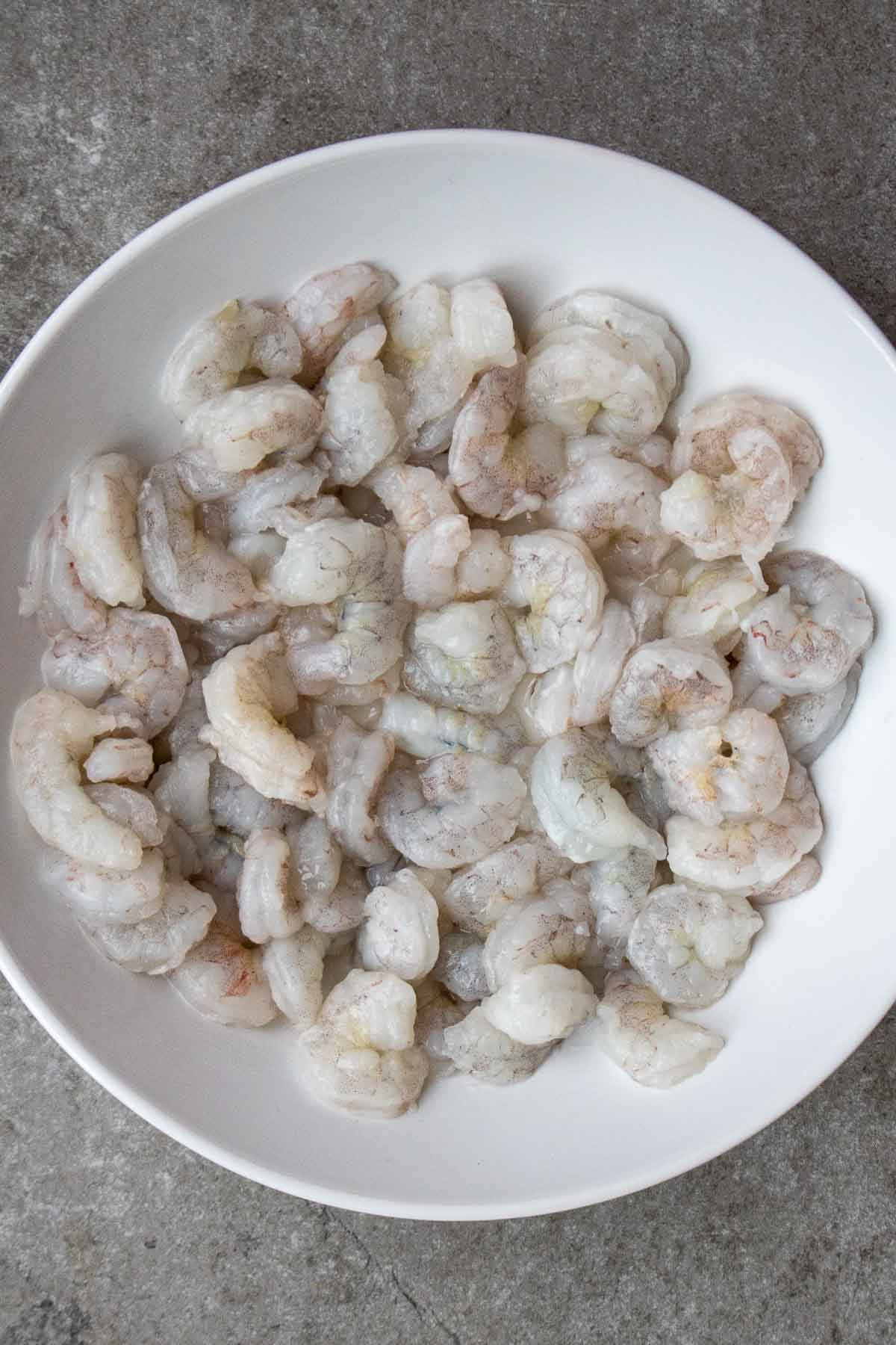 White bowl filled with fresh shrimp.