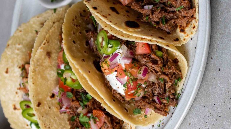 beef broth beef chuck roast chuck roast cooking methods dietary adaptations family-friendly meal prep Mexican shredded beef tacos overcooking reheating shredded beef slow-cooked beef Spices storage taco night tender beef tomato paste toppings versatile recipe 