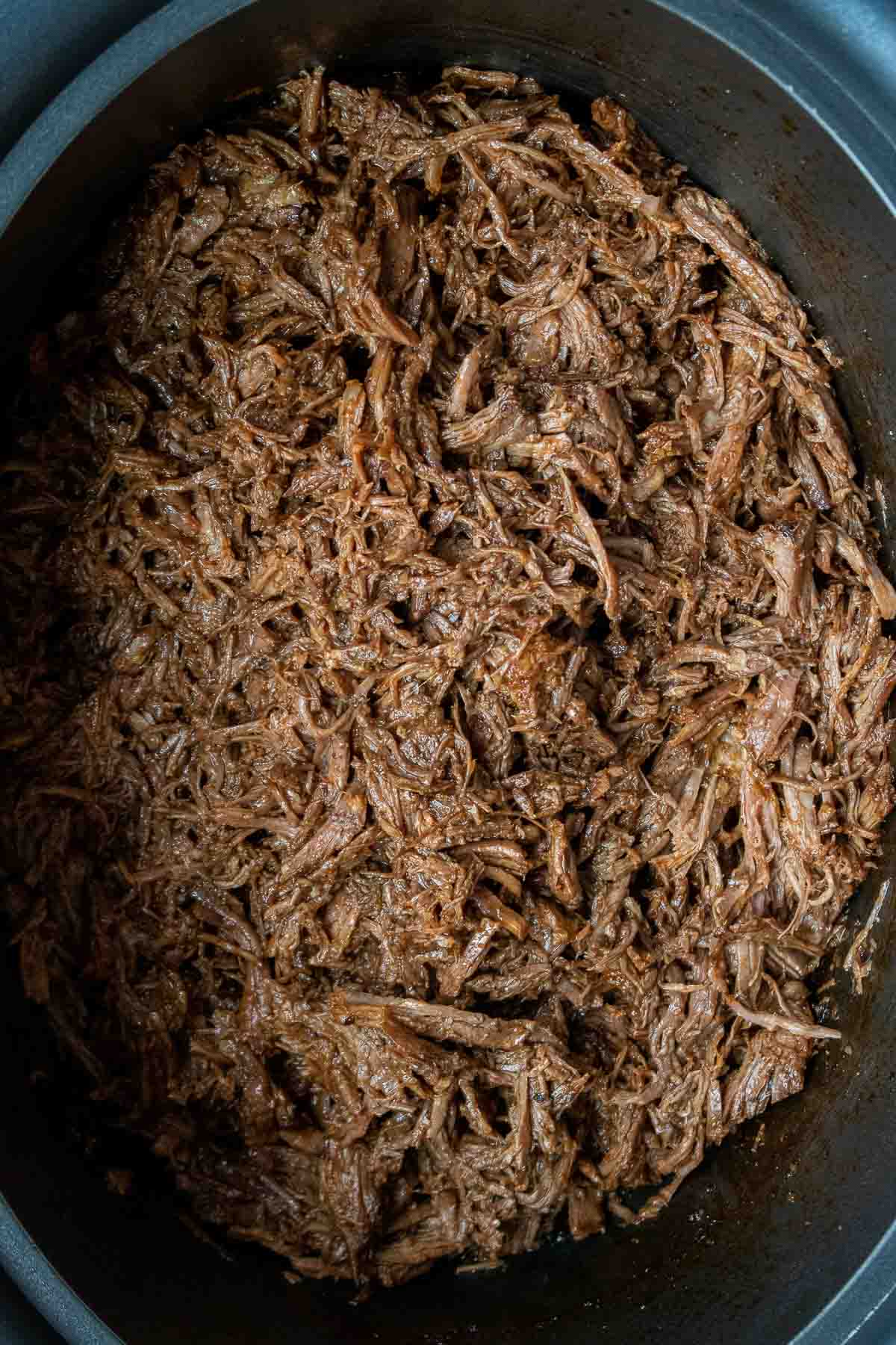 Mexican shredded beef for tacos in a slow cooker.