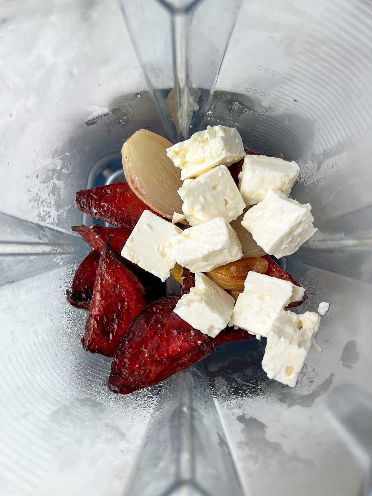 Roasted beets, roasted shallot, roasted garlic, and feta in a blender.